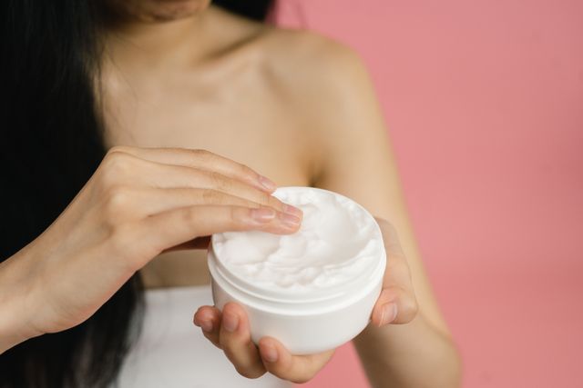 Why Ceramides Matter More in Fall: The Science Behind a Healthy Skin Barrier Applying a moisturizer to support skin hydration and the skin barrier.